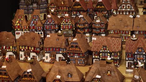 series-of-toy-village-pieces-of-alsace-architecture-at-Festive-Christmas-market-in-Strasbourg,-France-Europe