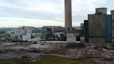 Fiddlers-ferry-power-station-aerial-view-wreckage-of-demolished-cooling-towers-and-disused-factory-remains,-Zoom-out-shot