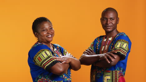 African-american-couple-in-traditional-attire-posing-on-camera
