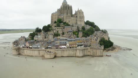 Aerial-Drone-Camera-Medium-Close-Up-Shot-in-Mont-Saint-Michel-Castle-in-France