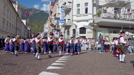 Marching-band-in-traditional-costumes-at-the-annual-Grape-Festival-in-Meran---Merano,-South-Tyrol,-Italy
