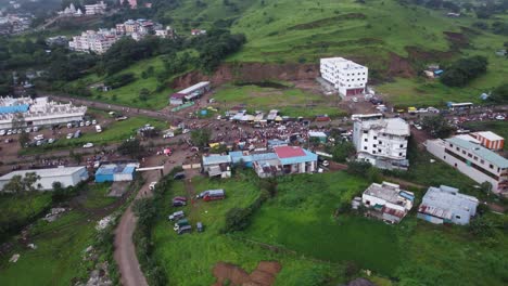 Aerial-view-of-the-crowd-of-Hindu-devotees-taking-on-foot-journey-around-the-spiritual-mountain-of-Brahmgiri-in-Trimbakeshwar,-Nashik,-Maharashtra,-India