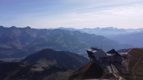 Birdseye-view-over-hiking-path-on-summit-of-moleson-in-Swiss-and-alps-on-background