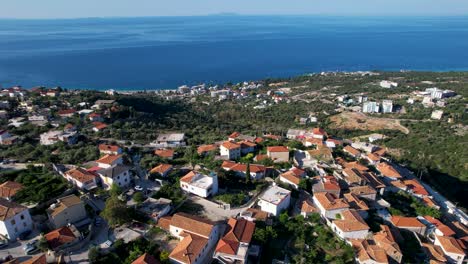 Seaside-Villages-Nestled-Amidst-Albania's-Majestic-Mountains,-Offering-Idyllic-Views-for-a-Perfect-Summer-Vacation-Escape
