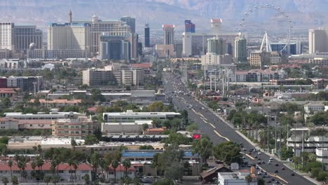 Las-Vegas-strip,-Nevada-tilt-up-zoomed-in-aerial-reveal-in-daytime
