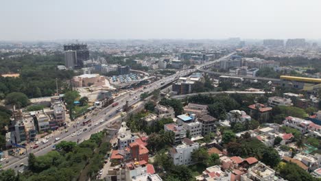Aerial-video-with-less-traffic-on-Central-Silk-Board-is-a-road-junction-in-Bangalore,-India