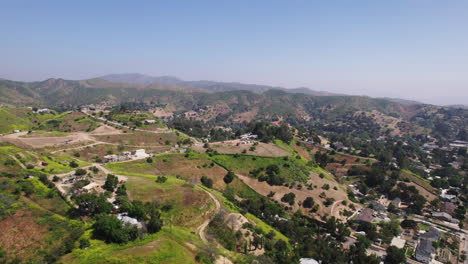 Aerial-view-of-residencies-in-hill-landscape-on-city-outskirts
