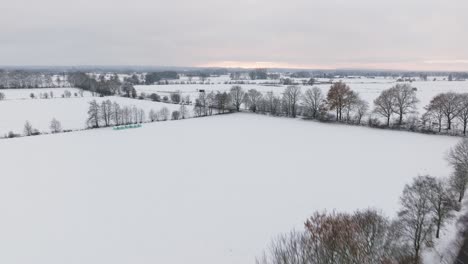 Aerial-view-of-a-snowy-rural-scene-in-northern-germany