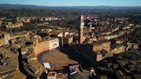 Beautiful-Orbiting-Drone-Shot-Above-Campo-Square-and-Mangia-Tower