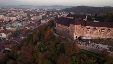 circular-discovering-shot-of-medieval-castle-in-Europe-with-historical-city-in-background