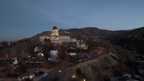 Salt-Lake-City,-Utah-state-capitol-building-at-nighttime---aerial-parallax