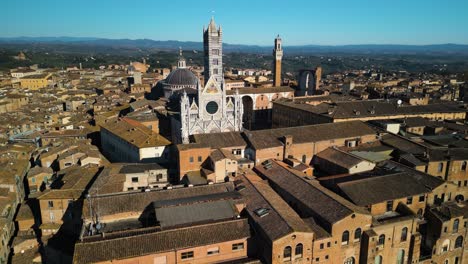 Cinematic-Establishing-Shot-Above-Siena,-Italy-on-Beautiful-Day-in-Tuscany