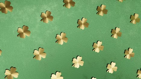golden-four-leaf-clover-on-green-background-good-luck-3d-rendering-animation-endless-looping-vertical