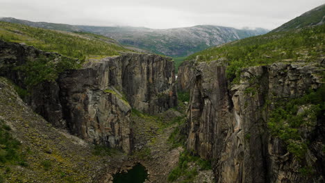 Dramatic-Hellmojuvet-canyon-with-steep-rocky-cliffs-in-remote-Norway