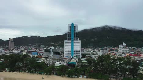 aerial-view-drone-going-backwards-showing-houses-around-patong-tower