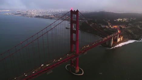 Aerial-view-around-the-busy-Golden-gate-bridge,-moody-evening-in-San-Francisco