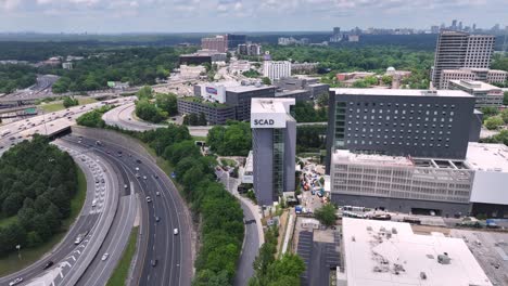 SCAD-University-building-and-street-view,-Atlanta-city-freeway,-expressway-road-flowing-traffic,-Georgia,-USA
