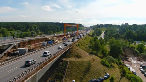 Construction-site-of-A1-bridge-in-Kaunas,-Lithuania,-aerial-view