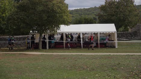 Slow-motion-shot-of-an-aid-station-with-competitors-at-the-Festival-Des-Templiers