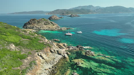 Catamaran-anchored-in-the-clear-waters-of-Corsica-on-a-sunny-day