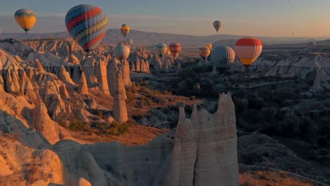The-drone-camera-is-moving-backwards-where-the-hot-air-balloons-are-having-fun