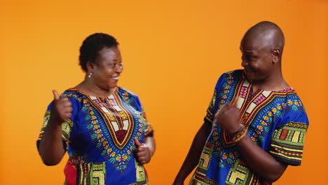 African-american-couple-showing-thumbs-up-symbol