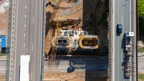Construction-site-of-new-columns-for-middle-bridge-in-Kaunas,-aerial-top-down-view