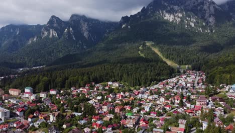 Aerial-view-of-Romanian-village-merged-with-foothills-of-Carpathian-Mountains
