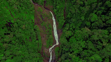 Waterfall-falling-on-red-rocks-in-the-Bijagual-ecological-reserve-in-Costa-Rica