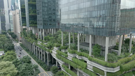 Aerial-dolly-shot-of-a-green-high-rise,-ParkRoyal-is-a-iconic-eco-friendly-and-stunning-hotel-in-a-garden-concept-that-incorporates-energy-saving-features-and-environmentally-friendly-technologies