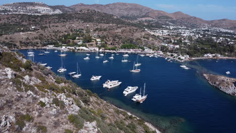 Yachts-And-Sailboats-In-The-Blue-Sea-In-Gumusluk,-Bodrum,-Turkey