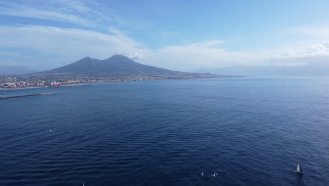 Tranquil-Seascape-With-Sailing-Boats-In-Naples,-Italy---Aerial-Drone-Shot