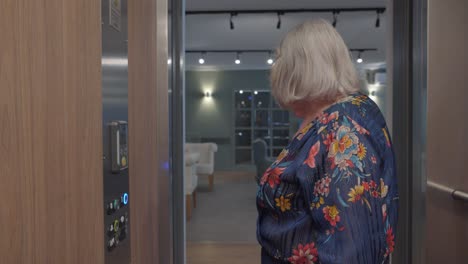 Elderly-Woman-Using-Elevator-in-French-Retirement-Home