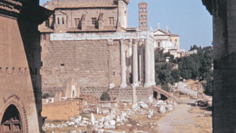 Person-Walks-Beside-the-Temple-of-Antoninus-and-Faustina-in-Rome-in-the-1960s