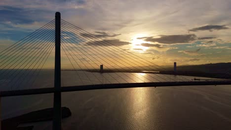 Cebu-Cordova-Link-Expressway,-A-beautiful-sunset-silhouettes-the-bridge