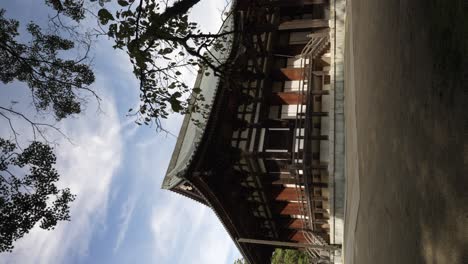 View-Of-Kondo-Hall-On-Sunny-Afternoon-With-Thin-Tree-In-Foreground-In-Koyasan