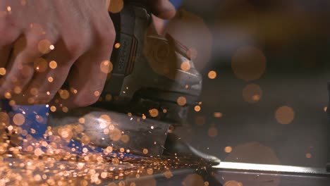 close-up-of-a-grinder-working-on-a-metal-pipe-in-super-slow-motion-with-industrial-background