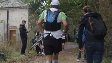 Slow-motion-following-shot-of-a-trail-runner-running-the-Festival-Des-Templiers