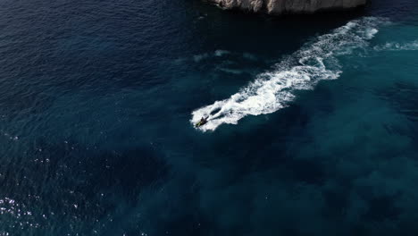 Aerial-Drone-footage-of-jet-ski-in-the-Sea-during-summer