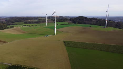 Drone-capture-of-wind-wheels-obove-green-fields