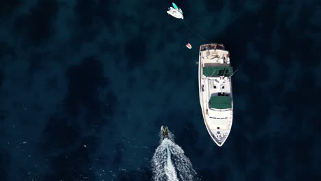 Drone-footage-of-Yacht-in-the-Sea-during-summer-jet-ski