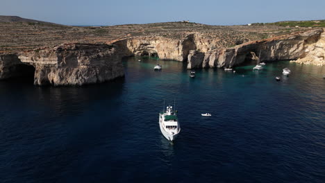 Aerial-Drone-footage-of-Yacht-in-the-Sea,-Malta