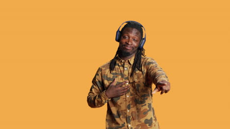 African-american-guy-enjoying-music-on-headphones