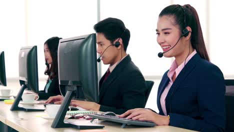 Business-people-wearing-headset-working-in-office