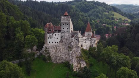 Aerial-close-up-of-Bran-castle,-medieval-gorgeous-landmark-in-Transylvania,-Romanian-Carpathian-region
