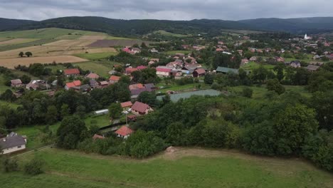 Above-perspective-of-Romanian-historical-village,-serene-landscapes-in-Carpathian-valleys