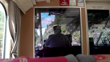 Inside-View-Seeing-Back-Of-Train-Driver-Through-Window-On-The-Limited-Express-Koya-Train-Heading-Towards-Gokurakubashi