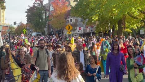 Crowd-of-people-wearing-costumes-celebrating-Halloween-in-Ashland,-Oregon