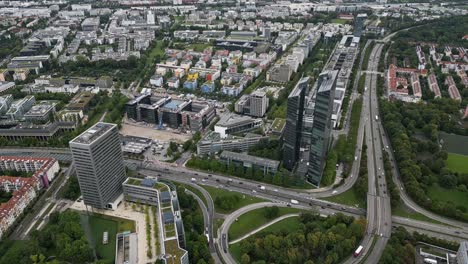 Cinematic-aerial-view,-Design-Offices-Highlight-Towers,-Munich-city