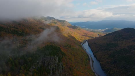Drone-video-of-a-cloud-inversion-at-a-lake-in-Upstate-New-York-surrounded-with-fall-colors